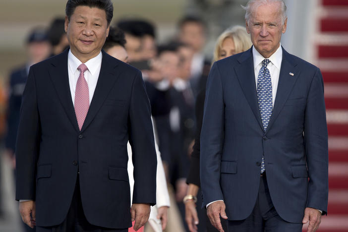 Chinese President Xi Jinping and then Vice President Joe Biden attend an arrival ceremony in Andrews Air Force Base, Md., in 2015. Biden is under pressure from both the left and the right to continue taking a hard line on trade with China.