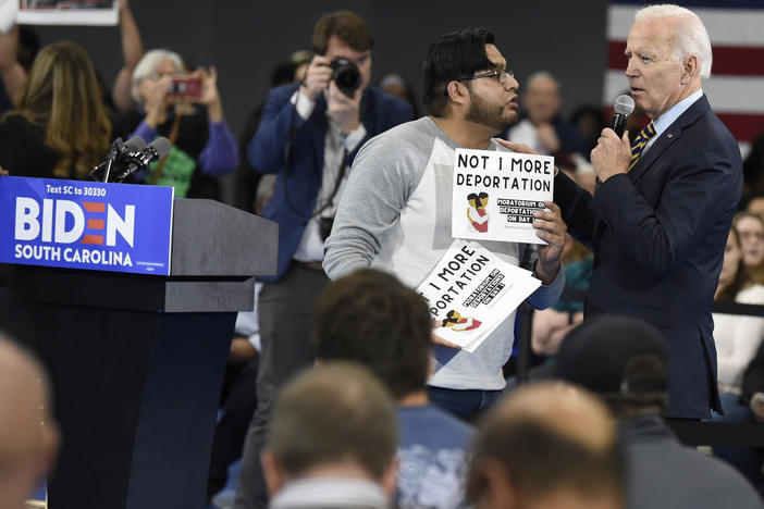 While campaigning in November 2019, Joe Biden talked with a protester about his stance on deportations at a town hall at Lander University in Greenwood, S.C. The Biden administration says it will rein in Immigration and Customs Enforcement, starting with a temporary moratorium on deportations.