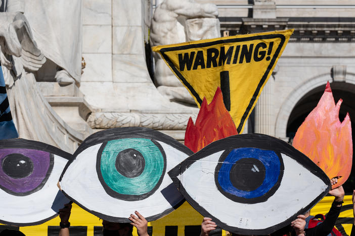 Climate activists protest in Washington, D.C., the day after the election. Some progressives want President-elect Joe Biden to bar any appointees with fossil fuel ties.