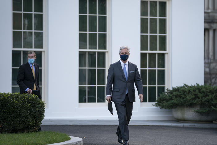 National security adviser Robert O'Brien arrives to speak to reporters outside the White House on Tuesday. O'Brien announced that President Trump has ordered 2500 U.S. troops to be withdrawn from Afghanistan and Iraq by Jan. 15.