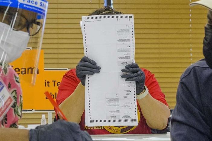 Fourteen auditors began the manual recount of around 71,000 presidential ballots in Macon, Ga., on Friday, part of a statewide recount of about 5 million votes cast across Georgia.