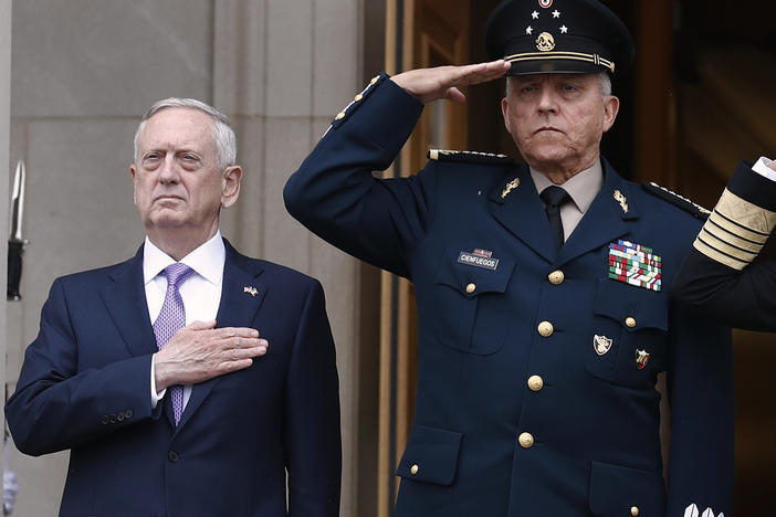 Former Defense Secretary Jim Mattis, left, and former Mexican Defense Secretary Salvador Cienfuegos Zepeda at the Pentagon in 2017. A U.S. district judge dropped drug charges against Cienfuegos Wednesday.