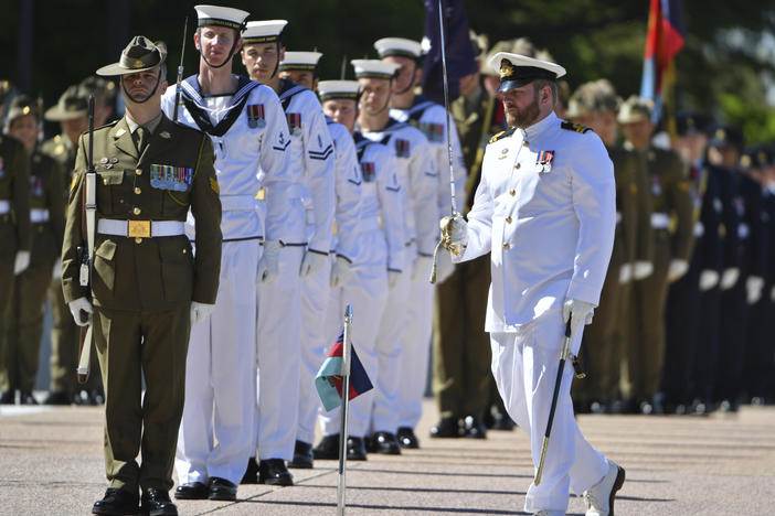 An honor guard is formed at Defence Headquarters in Canberra, Australia, before findings from the Inspector-General of the Australian Defence Force Afghanistan Inquiry are released on Thursday. A report found evidence that 25 soldiers unlawfully killed 39 Afghan prisoners, farmers and civilians.