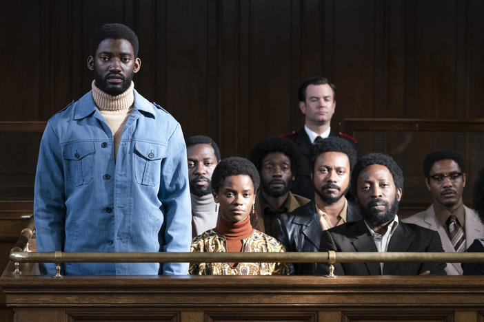 Malachi Kirby (standing) plays activist Darcus Howe in <em>Mangrove,</em> the first film in Steve McQueen's <em>Small Axe</em> anthology.