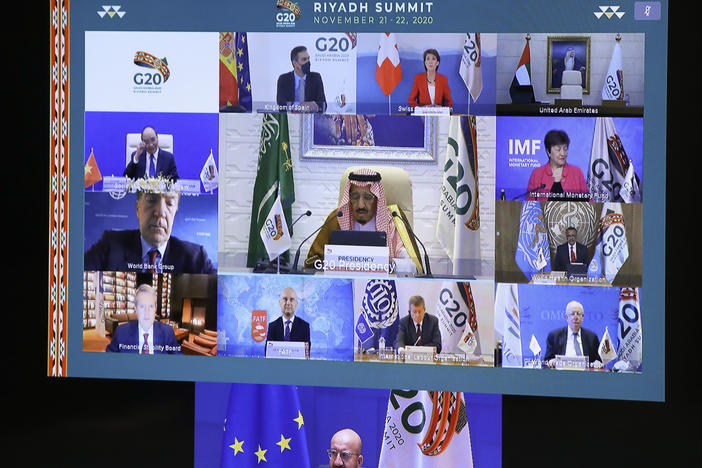 European Council President Charles Michel, on screen bottom, participates in a virtual G-20 meeting, hosted by Saudi Arabia, at the European Council building in Brussels on Saturday.