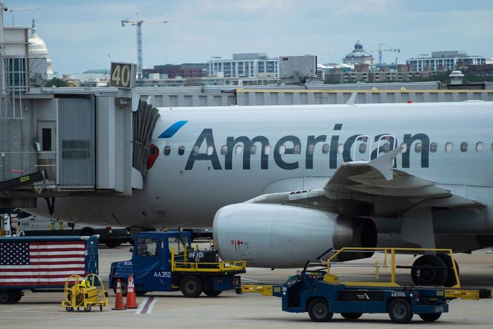 An American Airlines plane is seen at a gate at Ronald Reagan Washington National Airport in Arlington, Va., on May 12, 2020.