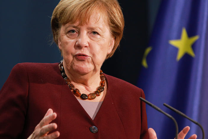 German Chancellor Angela Merkel speaks to the media following her participation in a virtual summit of G20 nations in which she expressed concern over a lack of plan to prepare coronavirus vaccinations for poorer countries.