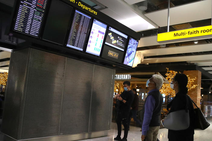 The British government will slash the quarantine time for some overseas travelers if they produce a negative coronavirus test after five days of quarantine.