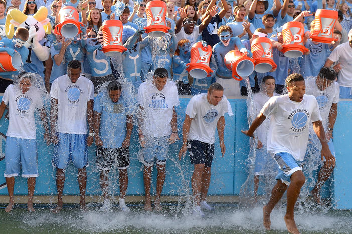 The North Carolina Tar Heels men's basketball team takes part in the the Ice Bucket Challenge, in 2014. At its height, the viral challenge attracted celebrities, famous athletes, and former presidents to take part.
