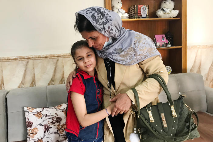 Kamo Zandinan says goodbye in the Mosul orphanage to a 10-year-old girl she believes is her daughter Sonya, taken from her by ISIS six years ago. The girl was rescued by police in March from an Arab family to whom she was not related. Zandinan is waiting for DNA tests to confirm whether the girl is her daughter.
