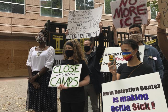 Protesters gather for a news conference in Atlanta earlier this year, shortly after the release of a complaint by whistleblower Dawn Wooten, a nurse at Irwin County Detention Center in Ocilla, Ga.