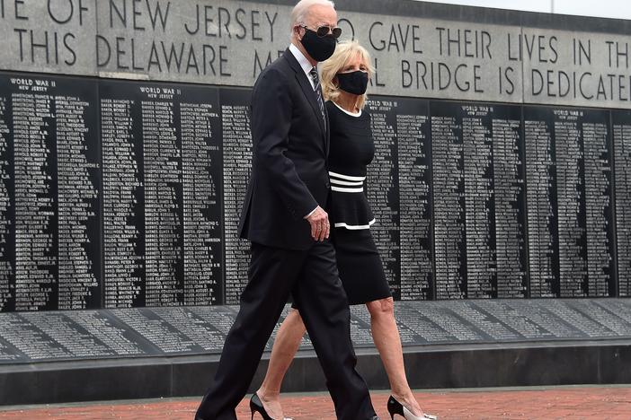 Joe Biden and his wife, Jill Biden, wear masks as they mark Memorial Day. The president-elect has consistently worn masks amid the pandemic, and he's already talking to governors about trying to implement a national mask mandate.