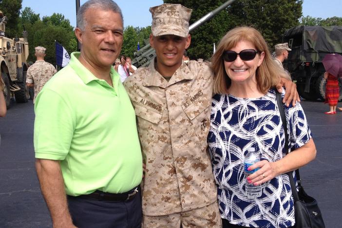 Marine Capt. Cristian Alphonso, center, pictured with his parents, Bonny, left, and Karen, right, in 2014. Alphonso was unable to visit his parents before an upcoming deployment because of Defense Dept. travel restrictions.