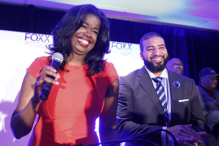 Then challenger Kim Foxx smiles at the crowd with her husband Kelley, as they celebrate her primary win as Cook County State's Attorney in 2016.