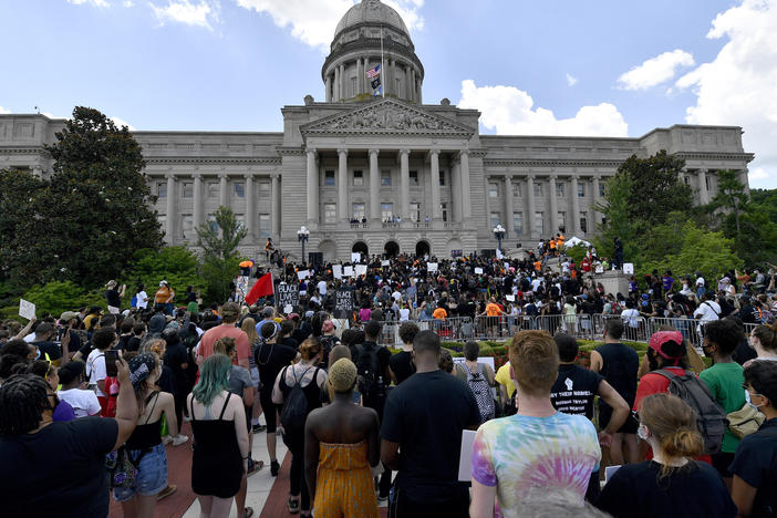 A crowd gathers for a rally to demand justice in the death of Breonna Taylor on the steps of the the Kentucky State Capitol in June. Taylor was killed in her apartment while Louisville police served a warrant.