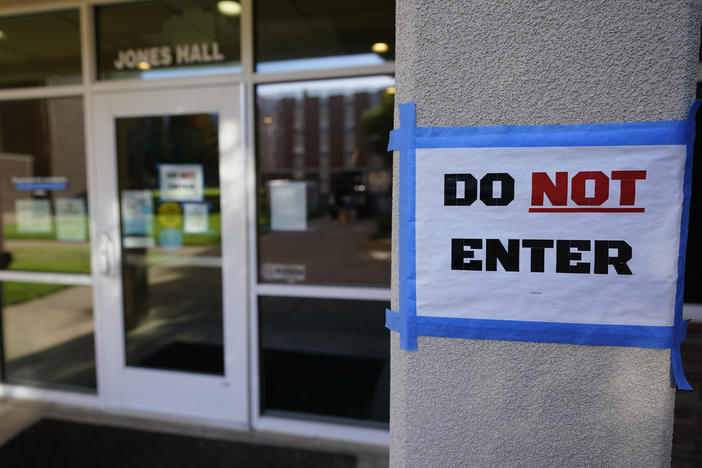 The doorway to Jones Hall is shown at Utah State University in September, where about 300 students were being quarantined to their rooms as a precaution.