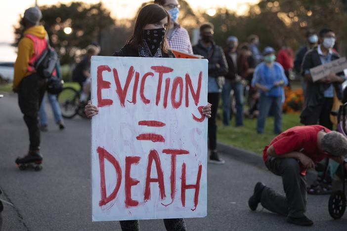 Housing activists gather in Swampscott, Mass., in October to call on the state's governor to support more robust protections against evictions and foreclosures during the pandemic.