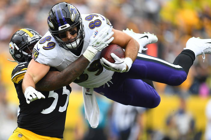 Mark Andrews, right, of the Baltimore Ravens hurdles Devin Bush, left, of the Pittsburgh Steelers during the first quarter at Heinz Field on Oct. 6, 2019 in Pittsburgh. This season, the Thanksgiving matchup between the two teams has been canceled due to a coronavirus outbreak.