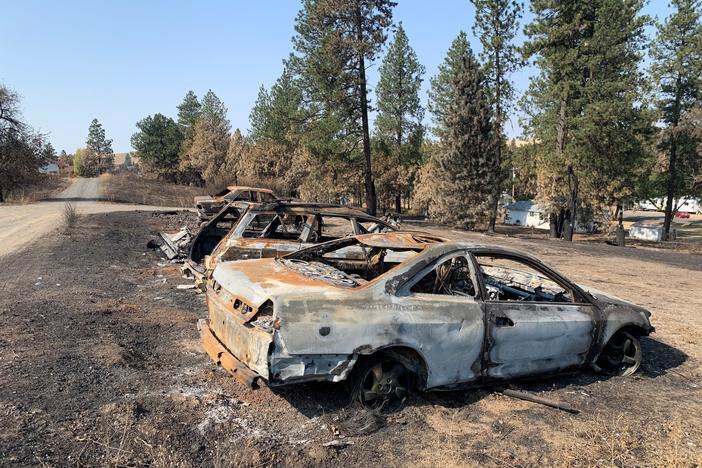 Burned cars from a wildfire that destroyed most of the eastern Washington town of Malden on Labor Day.