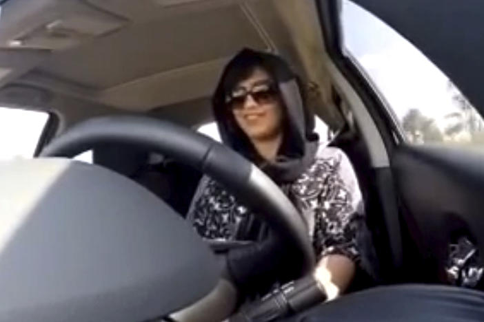 This Nov. 30, 2014 image made from video released by Loujain al-Hathloul shows her driving toward the United Arab Emirates-Saudi Arabia border before her arrest on Dec. 1, 2014, in Saudi Arabia. Al-Hathloul has been imprisoned for over two years and will be tried by a court established to oversee terrorism cases, her family said Wednesday.