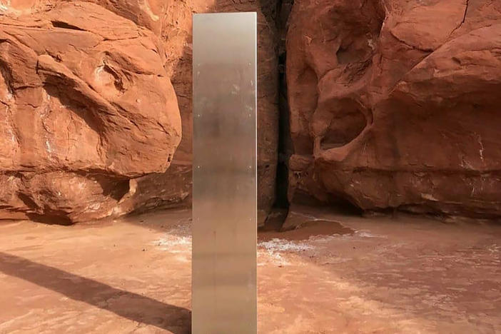 This Nov. 18 photo, provided by the Utah Department of Public Safety, shows a metal monolith in the ground in a remote area in Utah. The mysterious monolith has disappeared less than 10 days after it was spotted by wildlife biologists.
