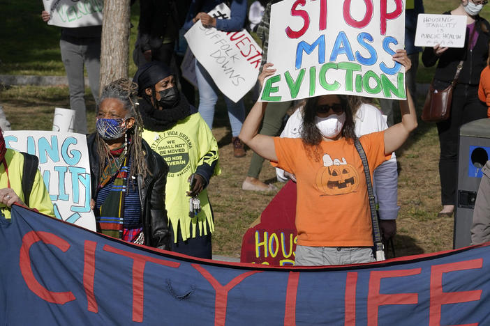 Protesters call for support for tenants and homeowners at risk of eviction during a demonstration on Oct. 11 in Boston. A federal moratorium on evictions is set to expire at the end of December.