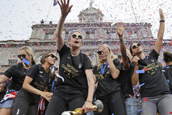 Megan Rapinoe (center) and Alex Morgan (right), pictured celebrating with U.S. women's soccer teammates in New York after a ticker tape parade, on July 10, 2019. "We are pleased that the USWNT Players have fought for – and achieved – long overdue equal working conditions," a spokeswoman for the team said on Tuesday.