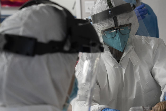 The U.S. hit a record high coronavirus hospitalization rate Wednesday, putting further strain on the nation's already stressed hospitals.