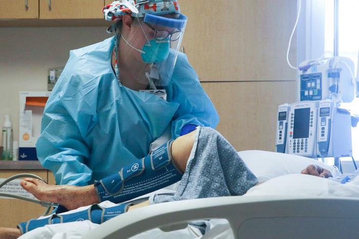 A nurse cares for a coronavirus patient in the intensive care unit at El Centro Regional Medical Center in California's hard-hit Imperial County on July 28.