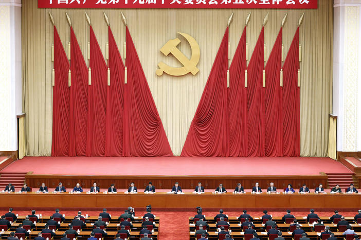 Chinese President Xi Jinping, center, also general secretary of the Chinese Communist Party, leads the fifth plenary session of the party's 19th Central Committee in October in Beijing. The U.S. State Department on Thursday tightened travel restrictions on members of the party and their families.