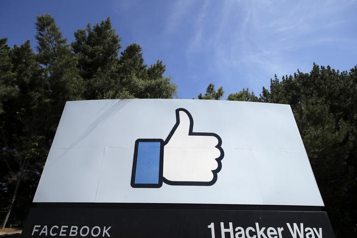 The thumbs-up Like logo on a sign at Facebook headquarters in Menlo Park, Calif. The Justice Dept. is suing the company for allegedly discriminating against U.S. workers in favor of temporary visa holders.