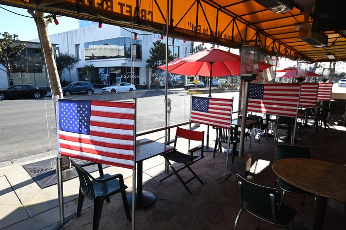 Patio tables are empty at a diner this week in West Hollywood, Calif., after Los Angeles County banned outdoor dining amid the pandemic. The struggles of restaurants and retailers are expected to have led to sharply slower job growth last month.