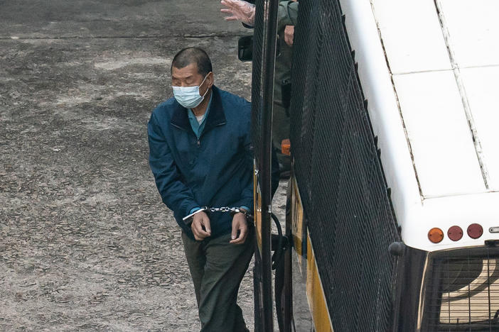 Jimmy Lai, publisher of the China-skeptic <em>Apple Daily</em> newspaper, is seen in custody in Hong Kong on Thursday. Charged with fraud, he can expect to be in custody until at least April 16, when his case will be heard next.