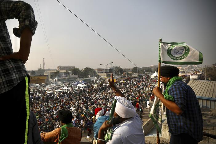 Farmers protest Thursday on a highway at the Delhi-Haryana state border in India. They have descended upon the borders of New Delhi to protest new farming laws that they say will open them to corporate exploitation.