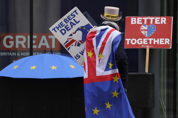 A pro-EU demonstrator sets up banners outside a London conference center, where trade talks were being held on Dec. 4.