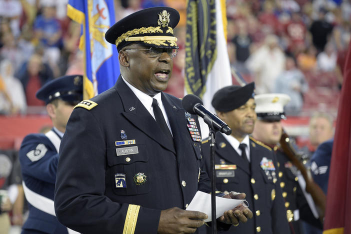 Gen. Lloyd Austin addresses military recruits during an induction ceremony in Tampa, Fla., in 2015.