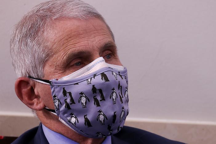 Dr. Anthony Fauci, director of the National Institute of Allergy and Infectious Diseases, warns that holiday gatherings could lead to "a really dark time for us" by mid-January.