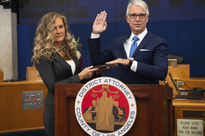 Los Angeles County District Attorney George Gascón is sworn in accompanied, by his wife Fabiola Kramsky. During his inaugural speech, he unveiled a series of criminal justice reforms that impact how prosecutors in his office pursue convictions, sentencing and cash bail.