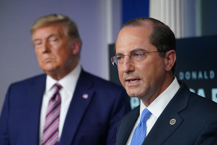 A proposed rule could cause headaches and extra work for the successor of Health and Human Services Secretary Alex Azar, seen with President Trump in November.