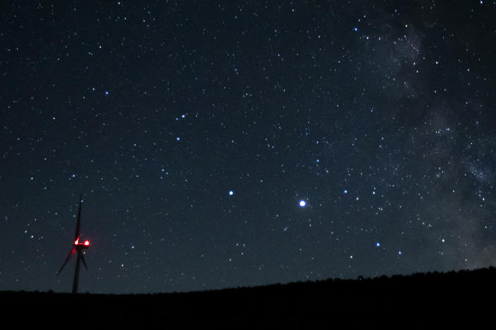 Saturn (center, left) and Jupiter (center, right) share a night sky earlier this year near Vantage, Wash. Already this past summer, the two planets were growing closer in the night sky.