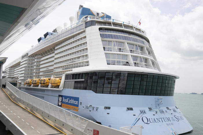 Royal Caribbean said that a guest on the Quantum of the Seas, shown here Wednesday in Singapore, tested positive for coronavirus after checking in with its medical team. The ship returned to port in accordance with government protocols.
