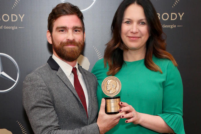 Rukmini Callimachi and colleague Andy Mills pose with their Peabody Award for <em>Caliphate</em> at the 78th Annual Peabody Awards Ceremony in May 2019. <em>The New York Times</em> says it is returning the award.