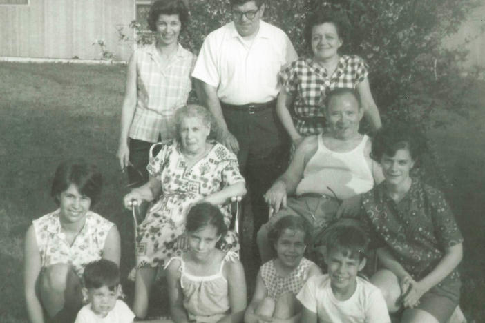 Howard Berkes (seated, front row right) volunteered to be part of a COVID-19 research study this year. He says his family, photographed here in the 1960s, had a history of stepping up during difficult times. That includes his grandparents (in middle), who fled the pogroms of Eastern Europe in the 1920s to raise a family in the United States.