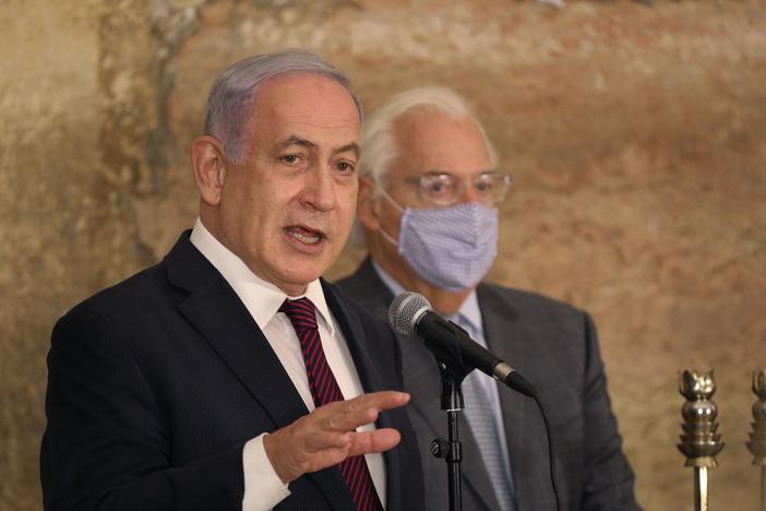 Israeli Prime Minister Benjamin Netanyahu, seen Thursday with U.S. Ambassador to Israel David Friedman at the Western Wall in Jerusalem's Old City, thanked Morocco's King Mohammed VI "for taking this historic decision to bring a historic peace between us."