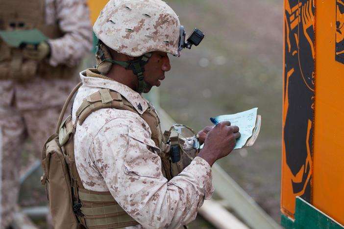 Jacques Yves Duroseau, shown here in 2016 when he was an active duty Marine, was found guilty by a federal jury over a weapons smuggling scheme.