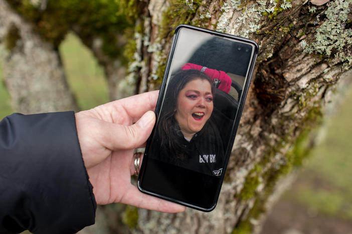 Kimberly Conger, Sarah McSweeney's nurse at her group home, shows a photo of McSweeney on her phone. She says McSweeney was outgoing and fun: "She absolutely adored going into malls and getting her makeup done and getting her hair done."