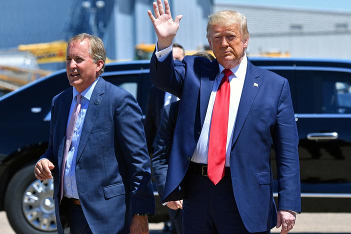 Texas Attorney General Ken Paxton, seen here with President Trump in June in Dallas, sued four states that Joe Biden carried in the general election, claiming their changes to election procedures during the pandemic violated federal law.