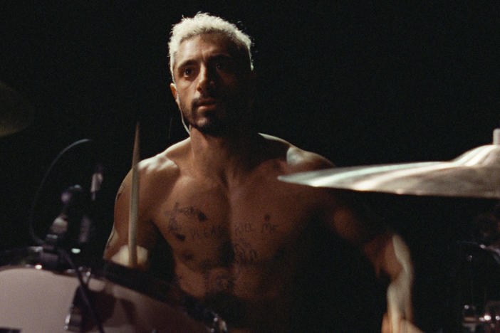 Riz Ahmed plays plays a drummer who goes deaf in <em>Sound of Metal.</em>