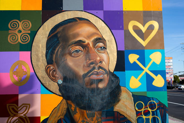 Nipsey Hussle is part of a mural featuring other local notable people on the wall of a bank in the rapper's Hyde Park neighborhood. In the wake of Hussle's March 2019 death, many murals of the beloved Los Angeles musician were painted in the Hyde Park neighborhood near his Marathon Clothing store.