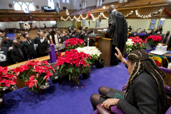 Pastor Rev. William Lamar IV leads his congregation in prayers, during a service at the Metropolitan AME Church in Washington, D.C., in 2014.